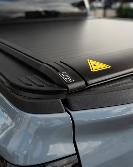 Electric roller cover close-up — latch and seal detail